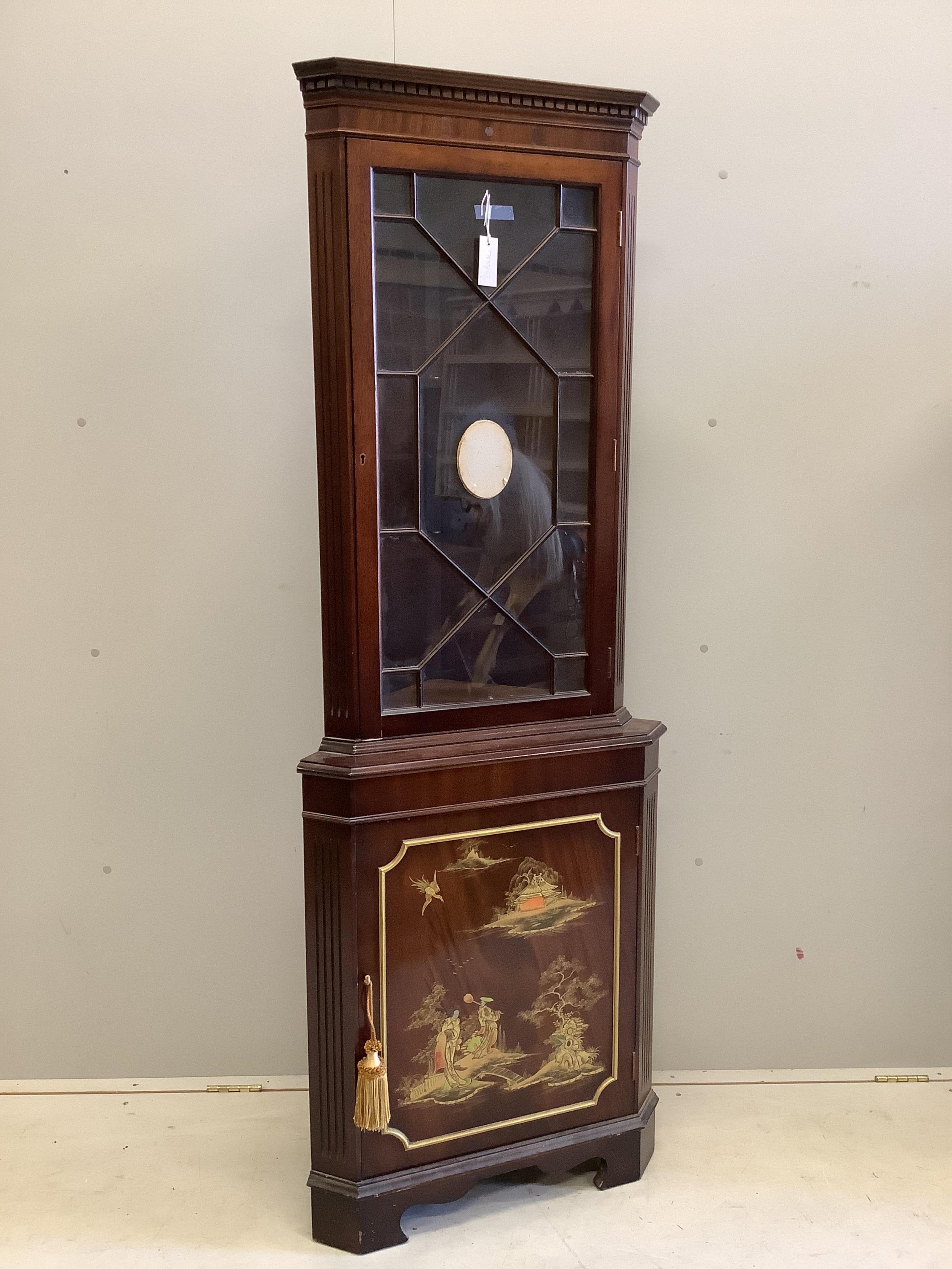 A suite of 20th century chinoiserie lacquer furniture comprising a standing corner cupboard, width 65cm, depth 40cm, height 182cm, a shaped oval centre table and four chairs